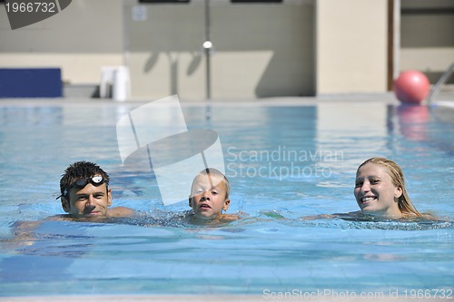 Image of happy young family have fun on swimming pool