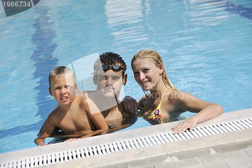 Image of happy young family have fun on swimming pool