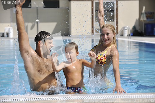 Image of happy young family have fun on swimming pool