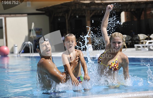 Image of happy young family have fun on swimming pool