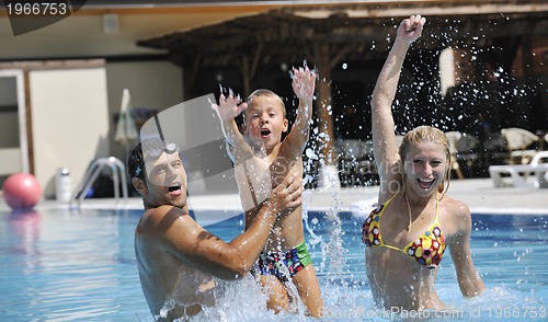 Image of happy young family have fun on swimming pool