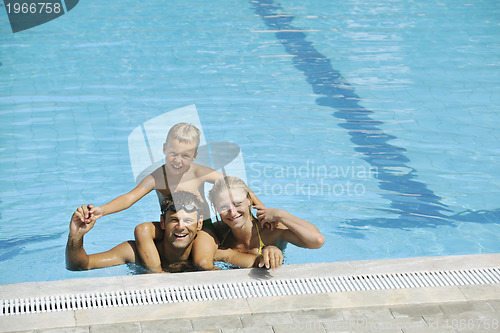 Image of happy young family have fun on swimming pool