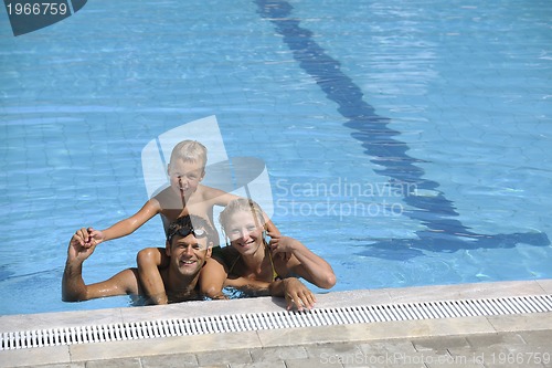 Image of happy young family have fun on swimming pool