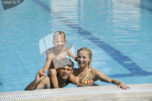 Image of happy young family have fun on swimming pool