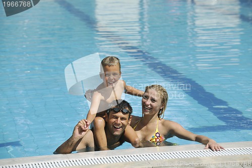 Image of happy young family have fun on swimming pool