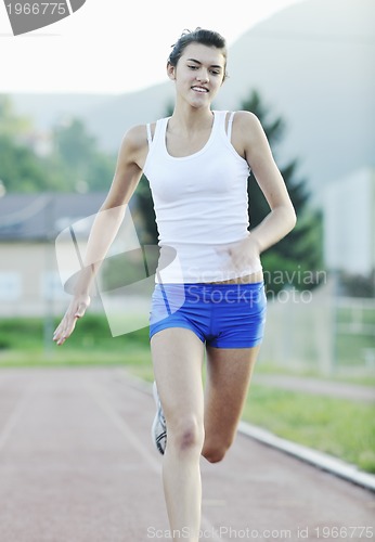 Image of woman jogging at early morning 