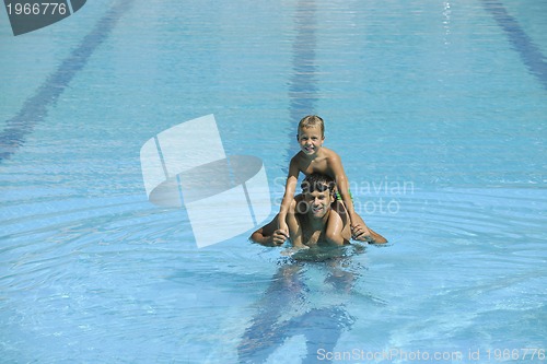 Image of happy young family have fun on swimming pool