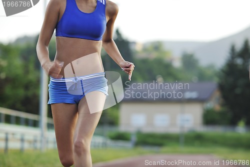 Image of woman jogging at early morning 