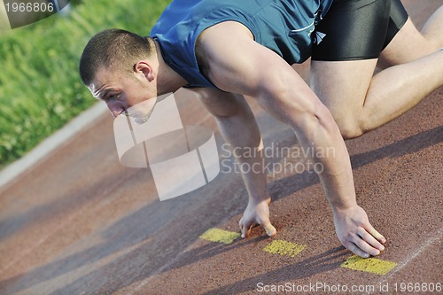 Image of young athlete on start 