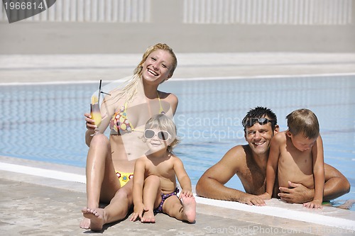 Image of happy young family have fun on swimming pool