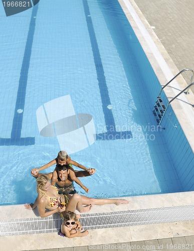 Image of happy young family have fun on swimming pool