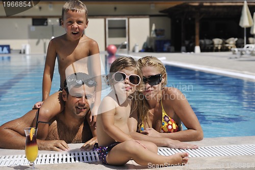 Image of happy young family have fun on swimming pool