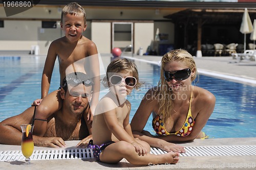 Image of happy young family have fun on swimming pool