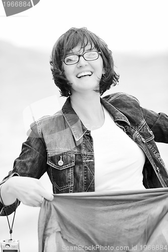 Image of beautiful young woman on beach with scarf