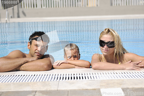 Image of happy young family have fun on swimming pool