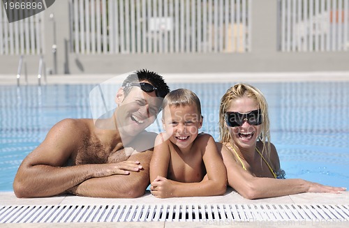 Image of happy young family have fun on swimming pool