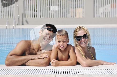 Image of happy young family have fun on swimming pool