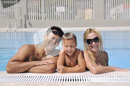 Image of happy young family have fun on swimming pool