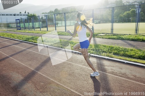 Image of woman jogging at early morning