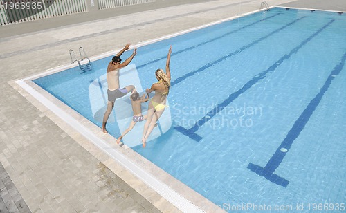 Image of happy young family have fun on swimming pool