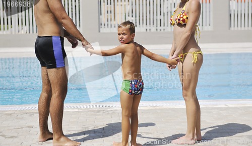 Image of happy young family have fun on swimming pool