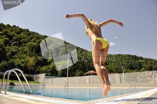 Image of woman relax on swimming pool