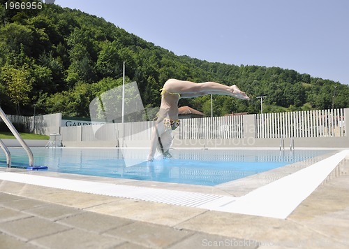 Image of beautiful woman relax on swimming pool