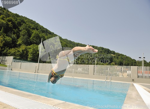 Image of beautiful woman relax on swimming pool