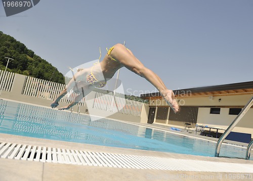 Image of beautiful woman relax on swimming pool