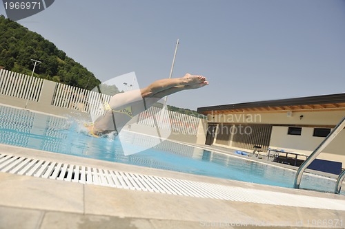 Image of beautiful woman relax on swimming pool