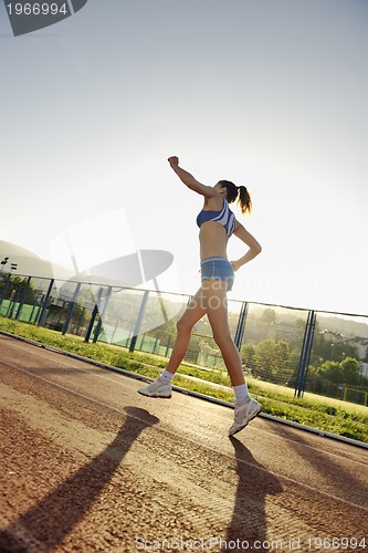 Image of woman jogging at early morning 