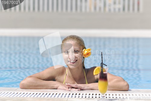 Image of beautiful woman relax on swimming pool