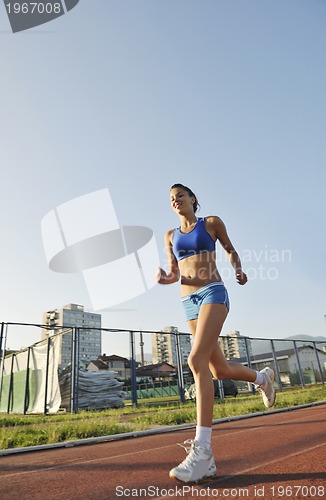 Image of woman jogging at early morning