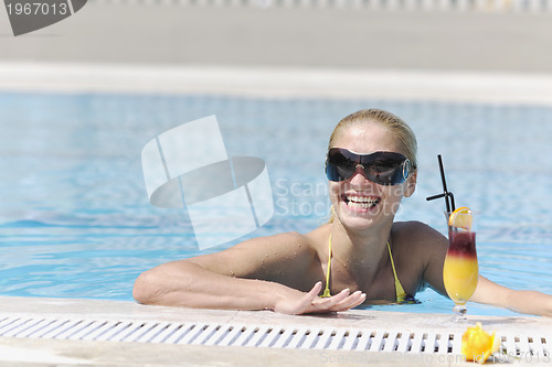 Image of woman relax on swimming pool