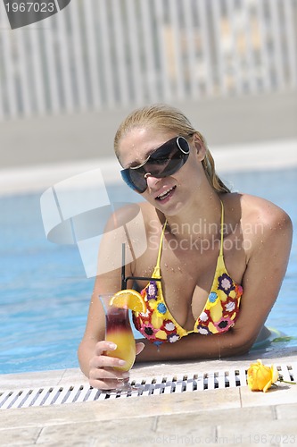 Image of woman relax on swimming pool