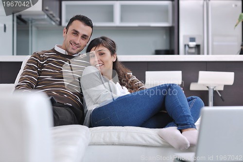 Image of happy young couple relax at home