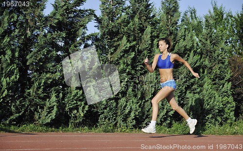 Image of woman jogging at early morning 