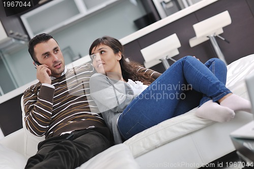 Image of happy young couple relax at home