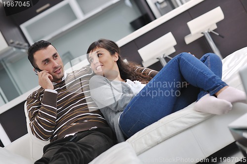 Image of happy young couple relax at home
