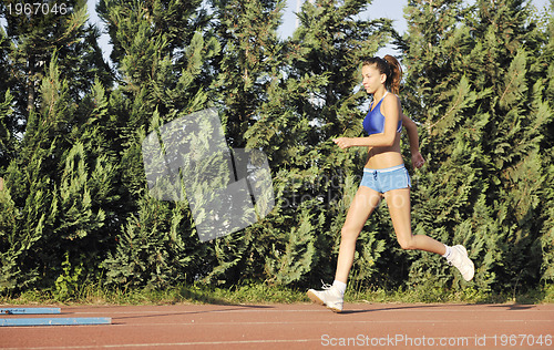 Image of woman jogging at early morning