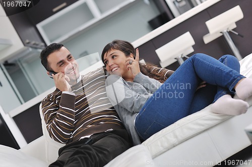 Image of happy young couple relax at home