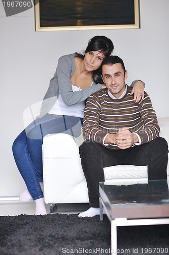Image of happy young couple relax at home
