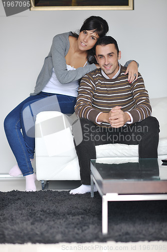 Image of happy young couple relax at home