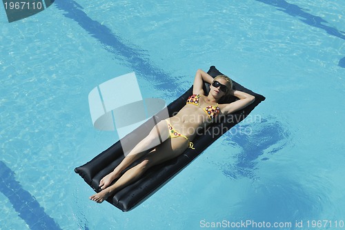 Image of woman relax on swimming pool