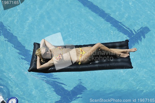 Image of woman relax on swimming pool