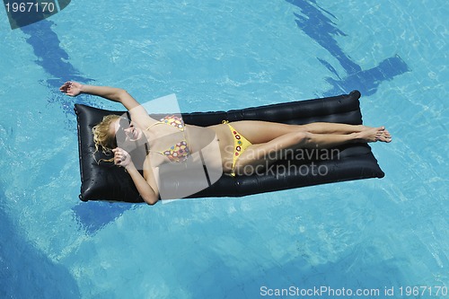 Image of woman relax on swimming pool