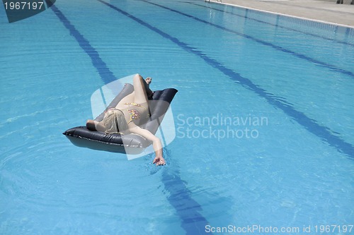 Image of beautiful woman relax on swimming pool