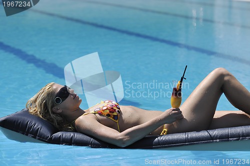 Image of woman relax on swimming pool