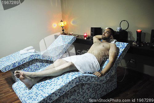 Image of man relaxing at spa