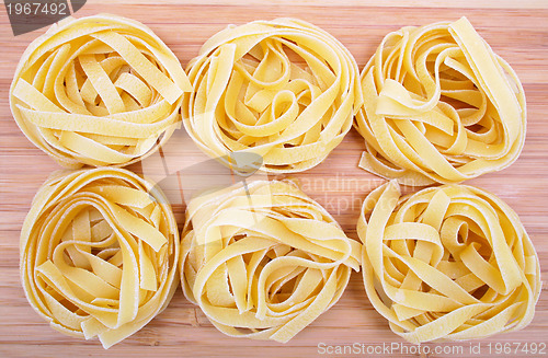 Image of Tagliatelle on the wooden background